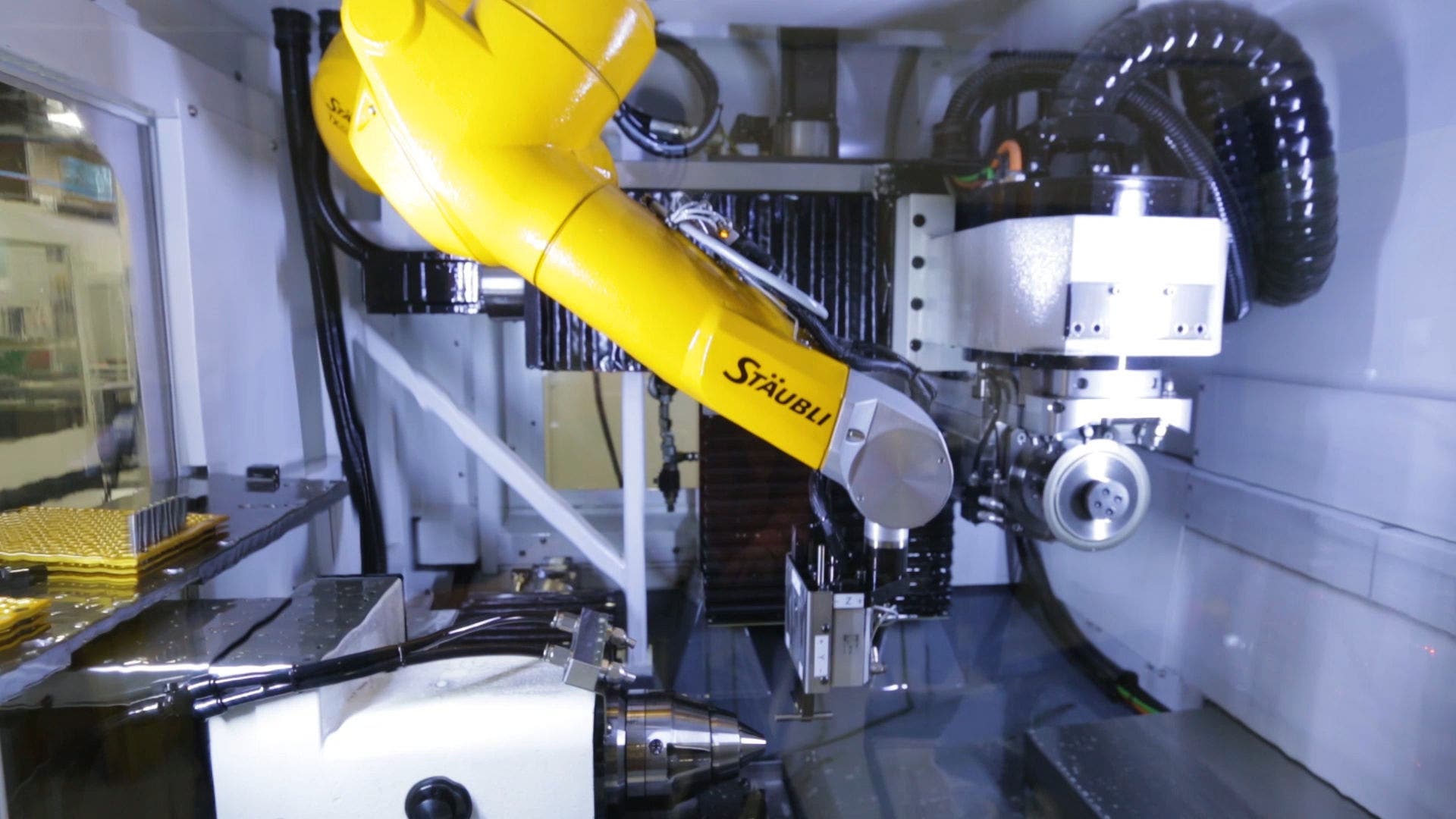 TX60 robot inside a grinding, sharpening machine